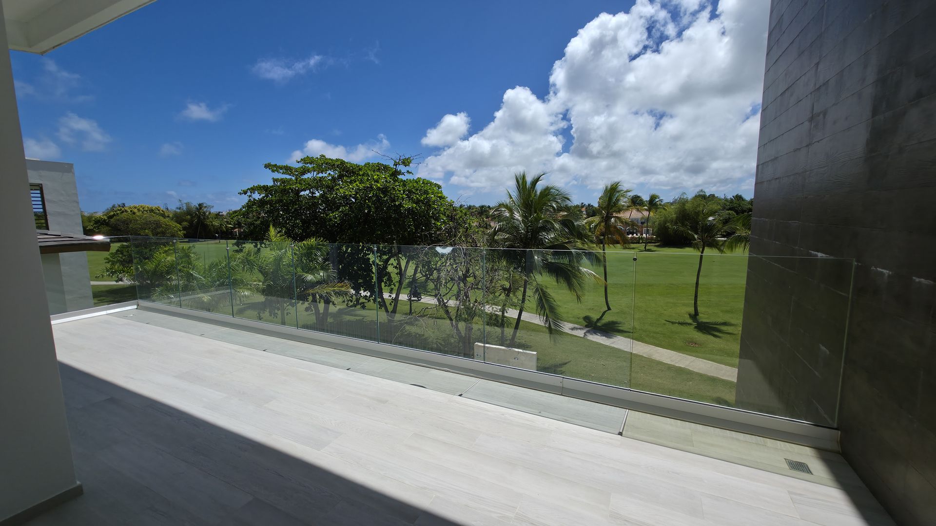 Balcony with afternoon light and vegetation