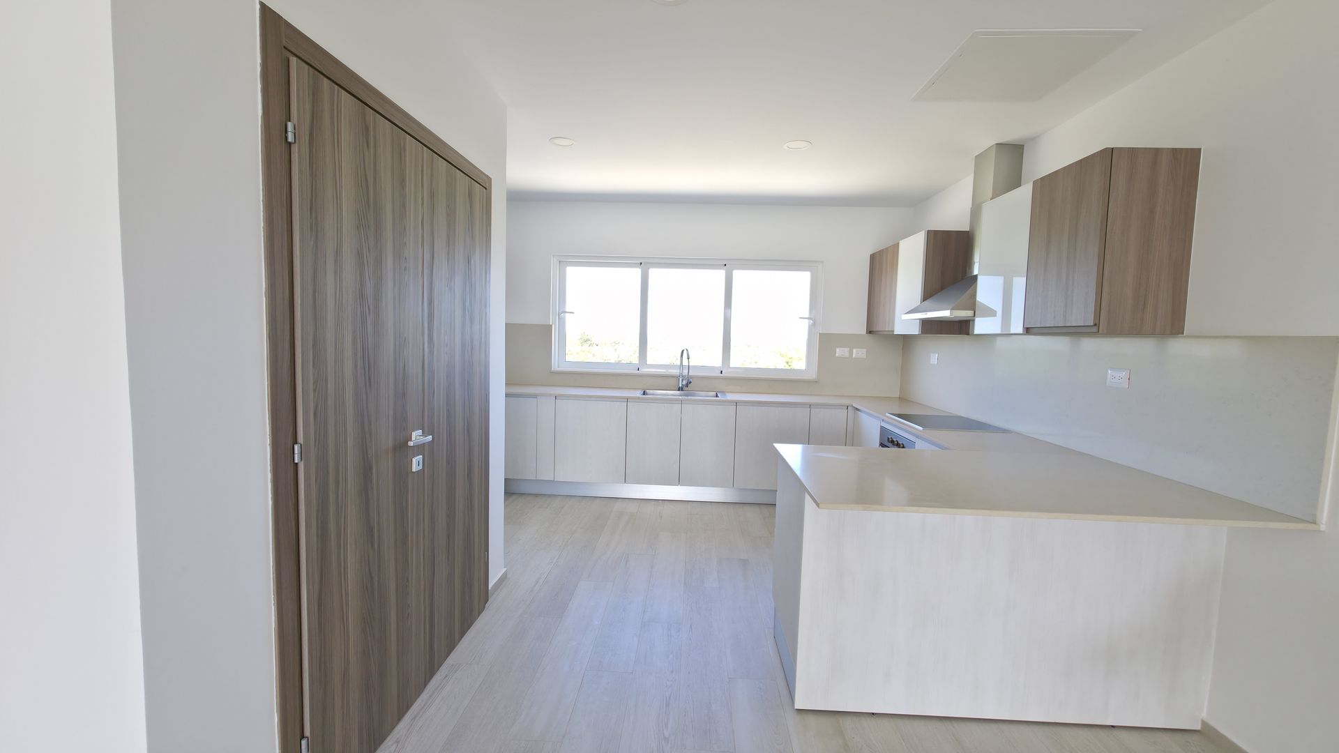 Open-concept kitchen with island and natural light