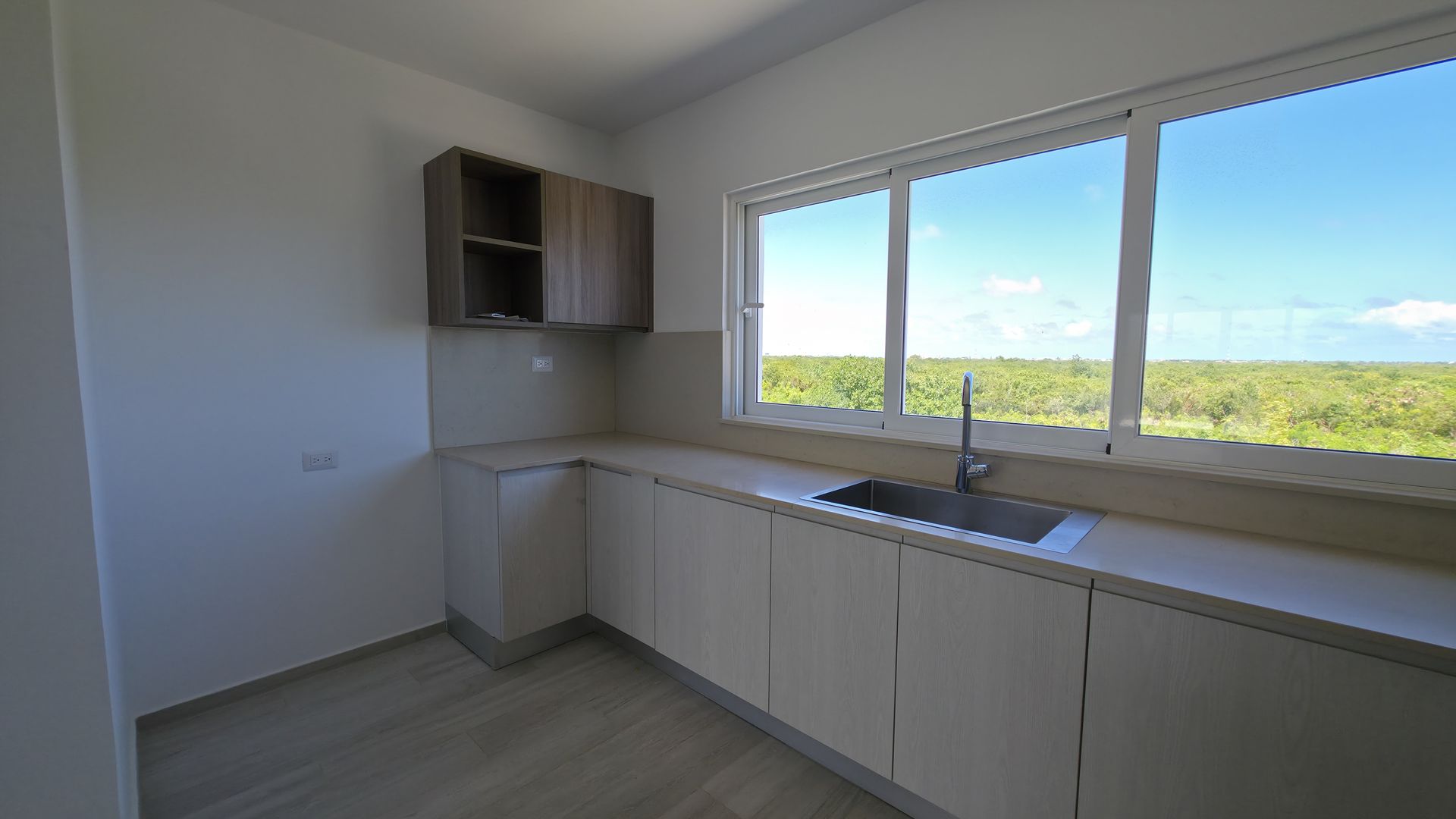 Kitchen with stunning green landscape window view