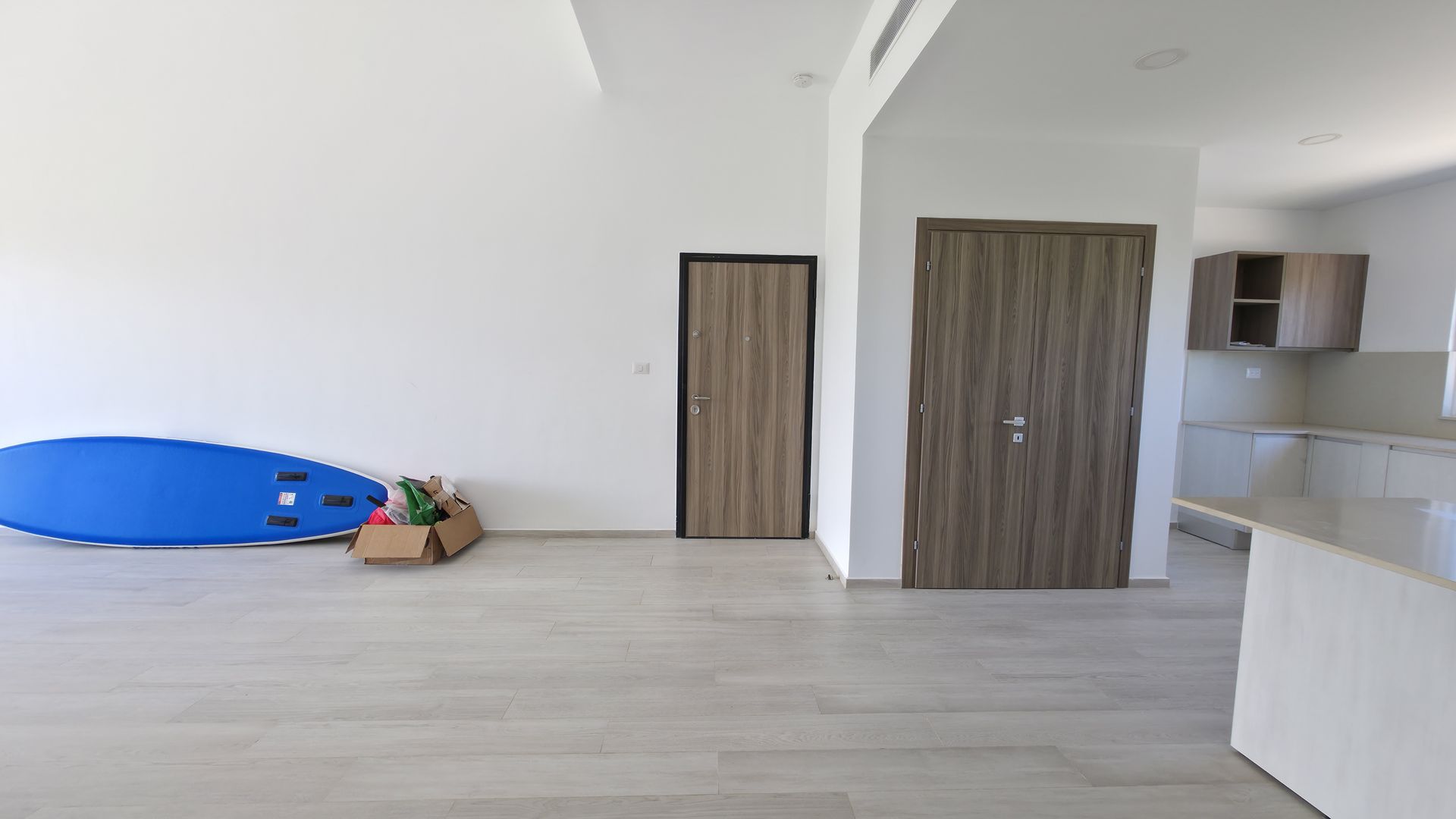 Living room with glass doors and entry area