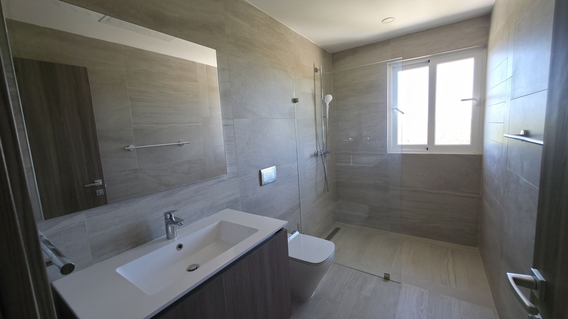 Master bathroom with dual vanity and glass shower