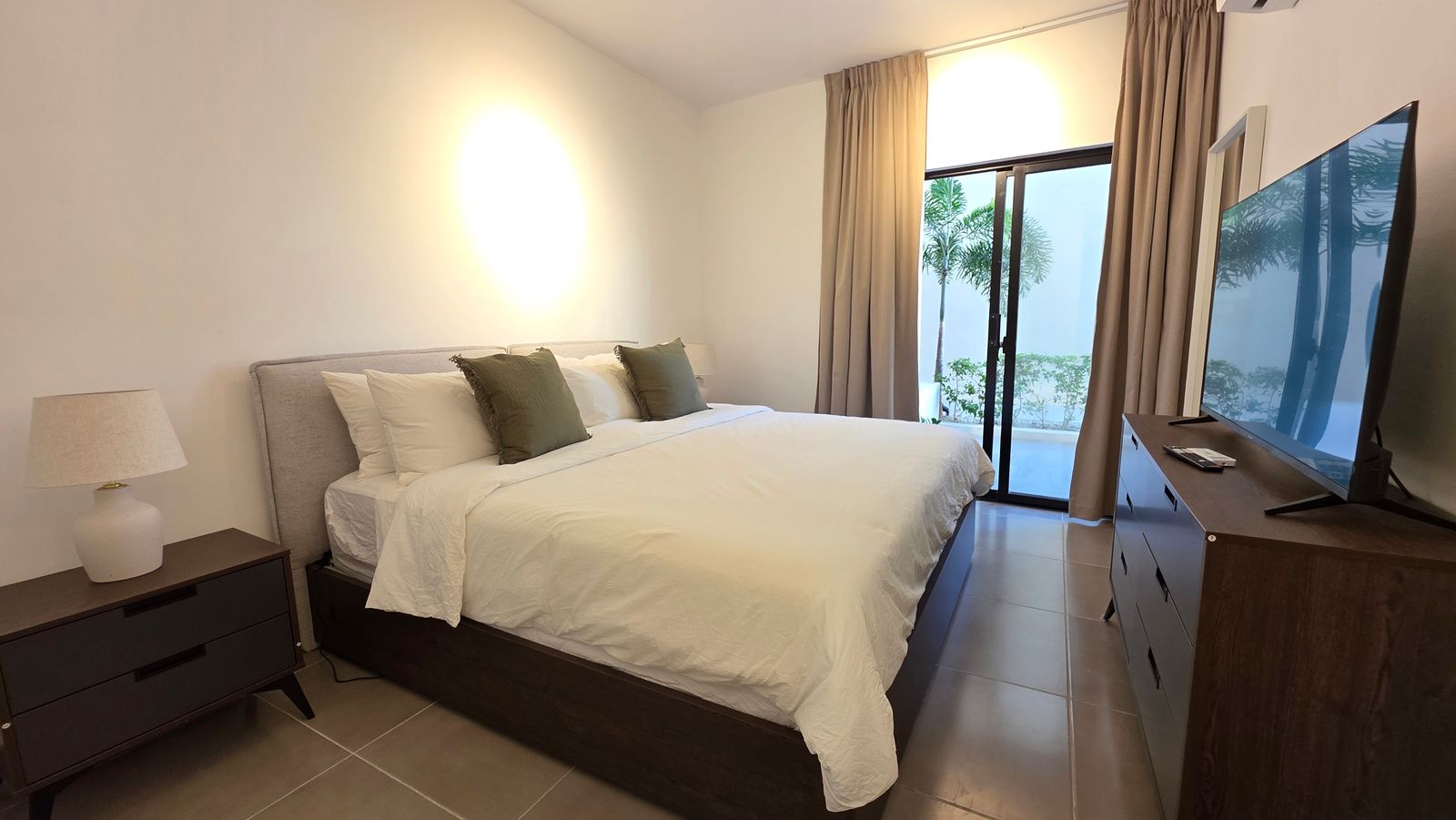 Bedroom with natural daylight and terrace access