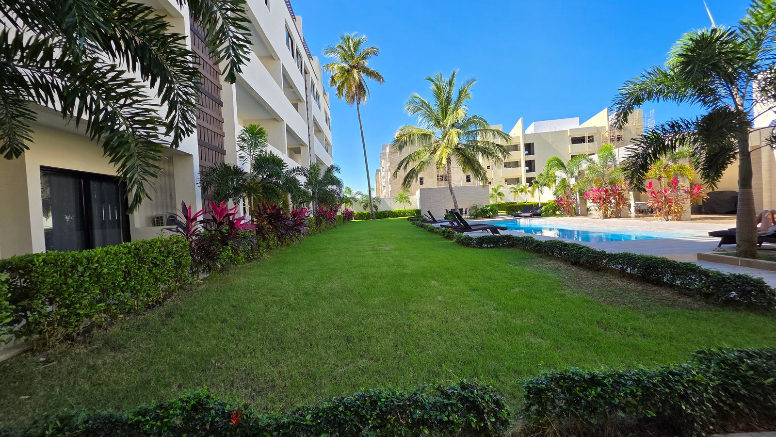 Lush gardens and pool area