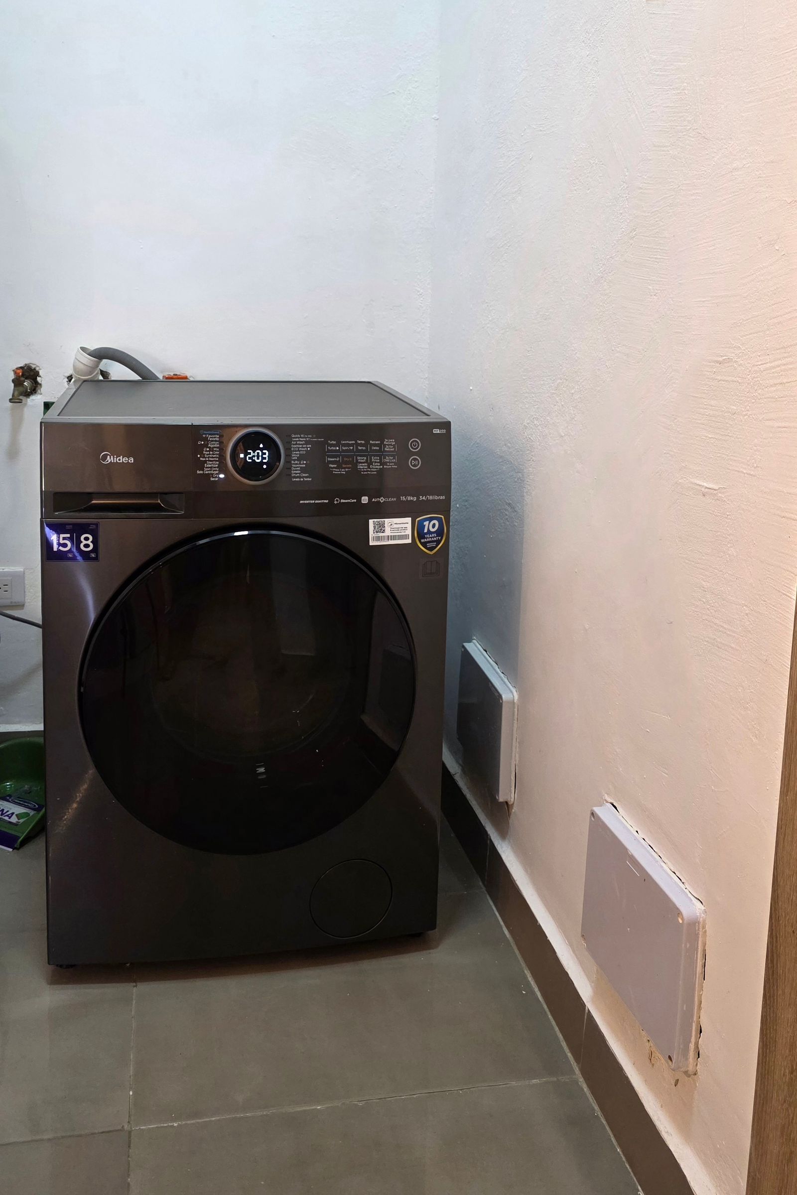 Laundry area with Midea washer-dryer
