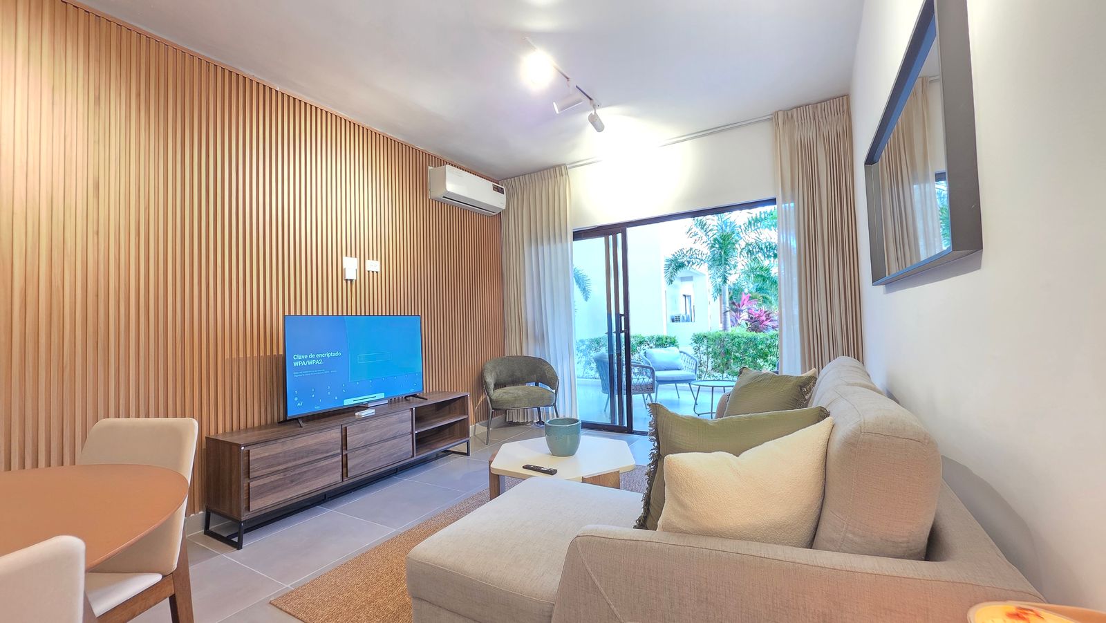 Living room with wood accent wall and smart TV