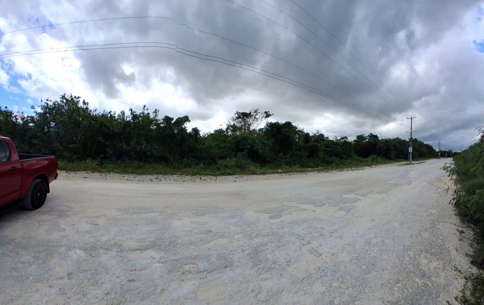Road view of the land parcel — alternate angle