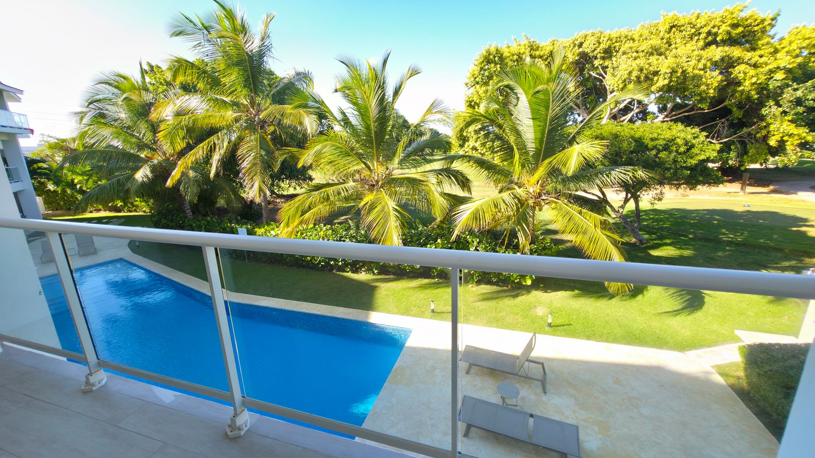 Balcony view of pool and resort grounds