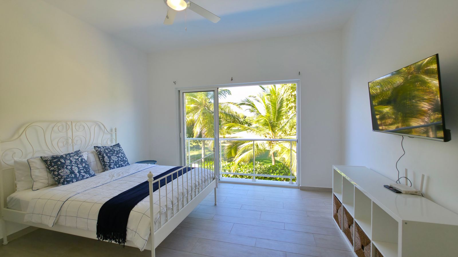 Master bedroom with smart TV and modern furniture