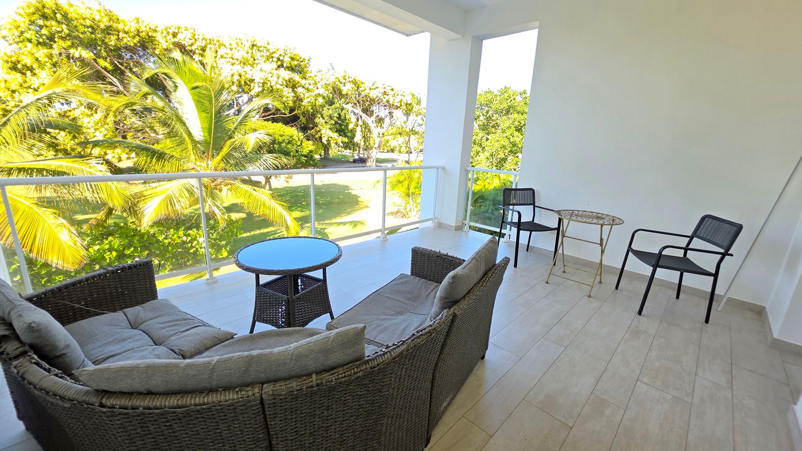 Furnished terrace with rattan seating overlooking pool